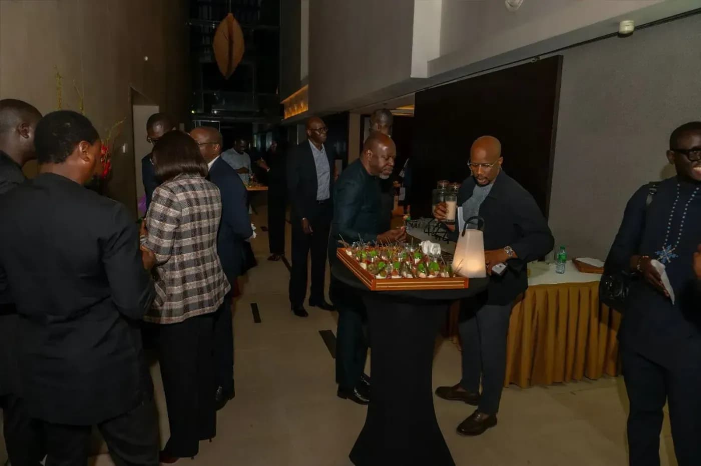Guests chatting around the buffet at the end of the session