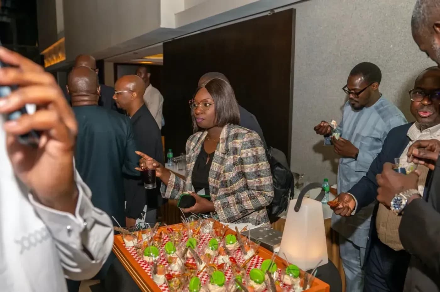 Attendees helping themselves at the buffet after the event